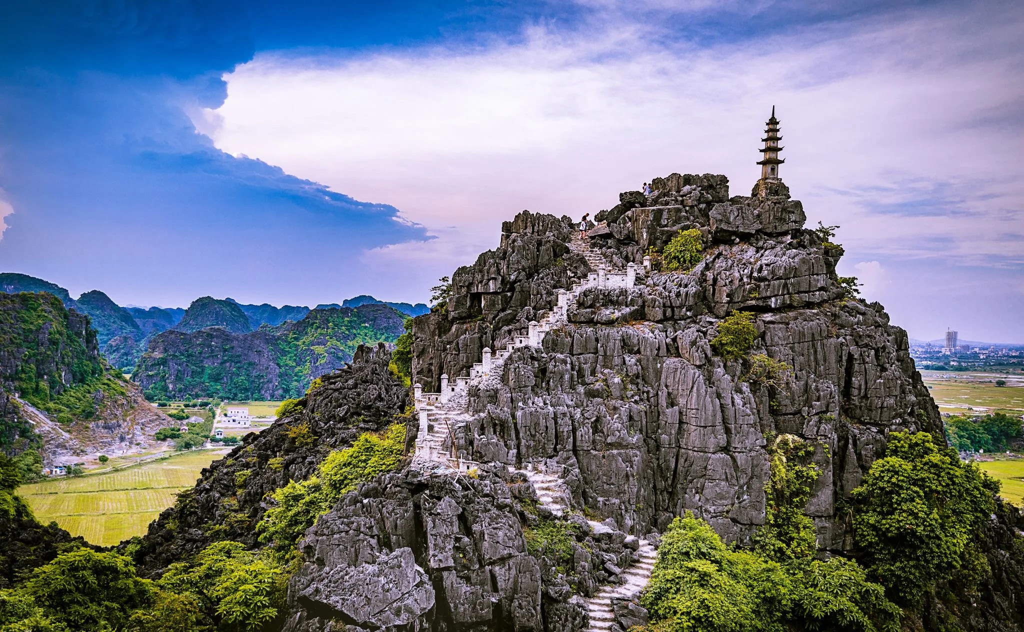 Mua Caves is a breathtaking viewpoint in Ninh Binh, known for its 500-step stone staircase leading to panoramic views
